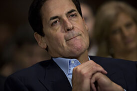 Mark Cuban, billionaire owner of the National Basketball Association's (NBA) Dallas Mavericks basketball team and chairman of AXS TV, listens during a Senate Judiciary Subcommittee hearing in Washington, D.C., U.S., on Wednesday, Dec. 7, 2016. AT&T Inc. Chief Executive Officer Randall Stephenson told Congress his company's planned $85.4 billion purchase of HBO and CNN owner Time Warner Inc. will help the telecommunications provider challenge cable companies for customers. Photographer: Andrew Harrer/Bloomberg via Getty Images